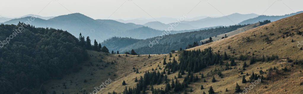 Mountain range with clouds drifting over the peaks